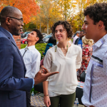 Dr. Taylor speaking with students at event